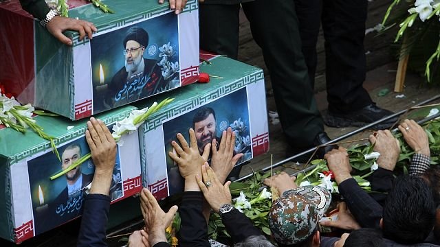 Thousands of Iranians surround late president’s coffin as 5-day mourning starts