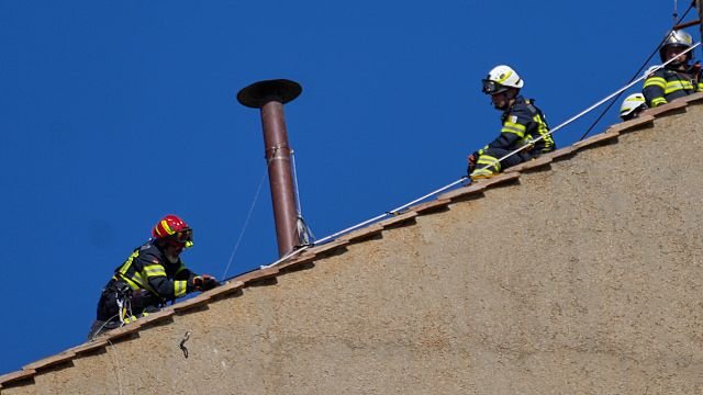 Vatican firefighters install chimney on top of Sistine Chapel ahead of conclave