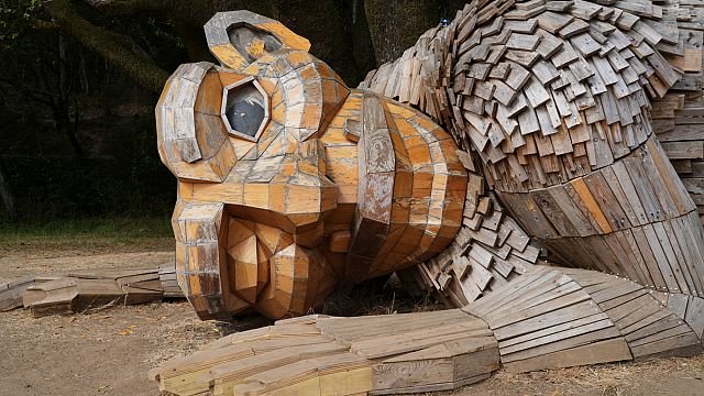 Giant trolls made from trash warn against environmental destruction