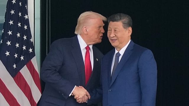 Trump, Xi meet in person as US and China move to ease trade tensions