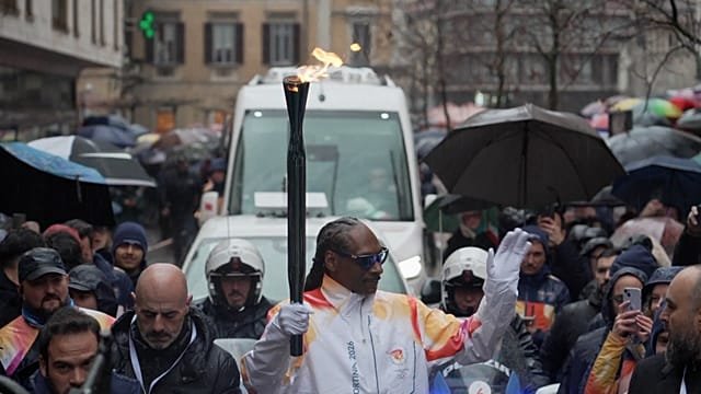 Snoop Dogg surprises Italy by joining Olympic torch relay in Gallarate