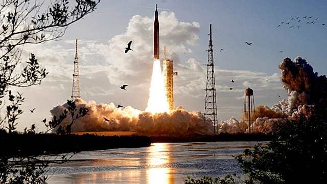 Astronauts begin NASA lunar mission after climactic blast-off