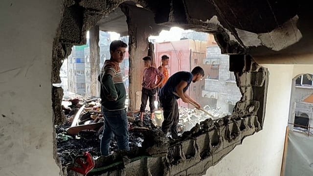 Gaza city residents survey destruction after overnight Israeli airstrike