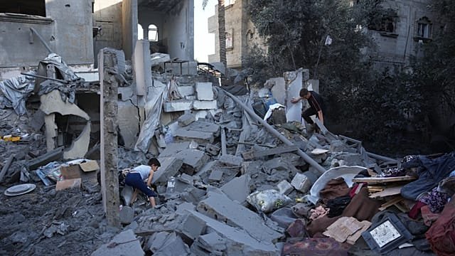 Gaza Families search ruins after Israeli strikes hit homes