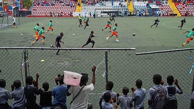 Schoolchildren in Haiti stage their own World Cup in call for peace