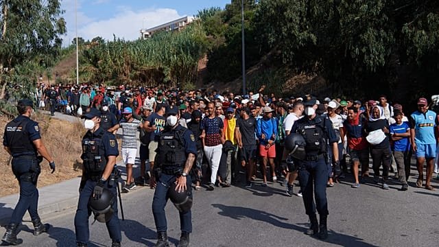 Spain moves hundreds of migrants from Ceuta beach to temporary shelters